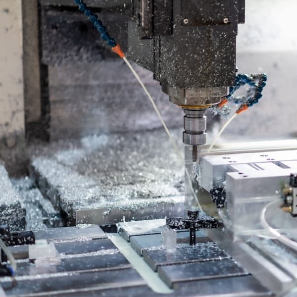 A CNC machining centre cutting metal stock