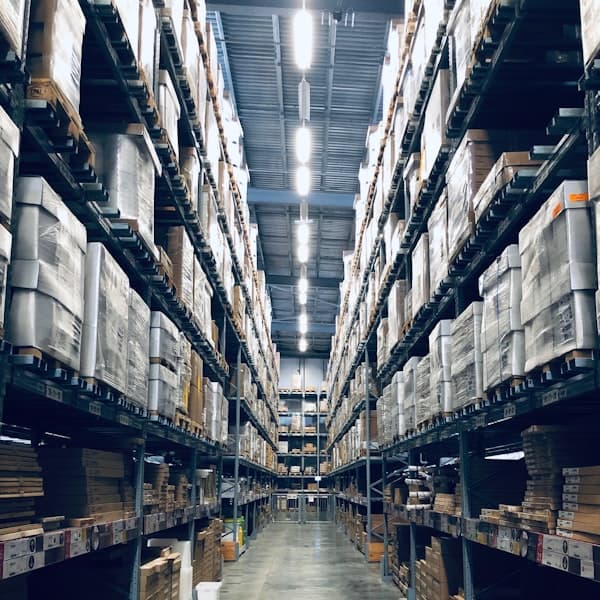 Palletised metal stock staged for shipment in a warehouse