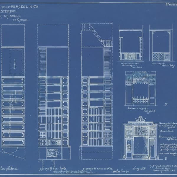 Engineering drawings and measuring tools on a bench